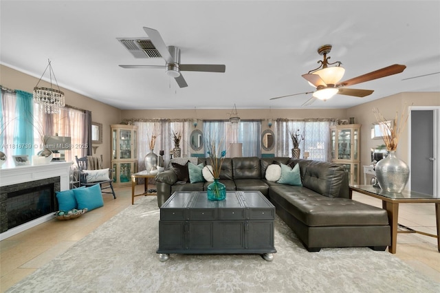 2430 N Dunwoodie Rd, Avon Park, FL 33825 - living room with a ceiling fan, plenty of natural light, and light tile patterned flooring