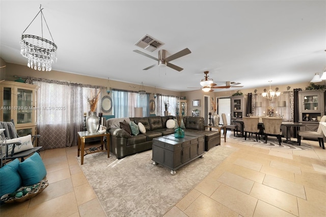 2430 N Dunwoodie Rd, Avon Park, FL 33825 - living area with a chandelier, light tile patterned floors, and ceiling fan