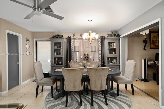 2430 N Dunwoodie Rd, Avon Park, FL 33825 - dining area with a chandelier, light tile patterned flooring, and a ceiling fan