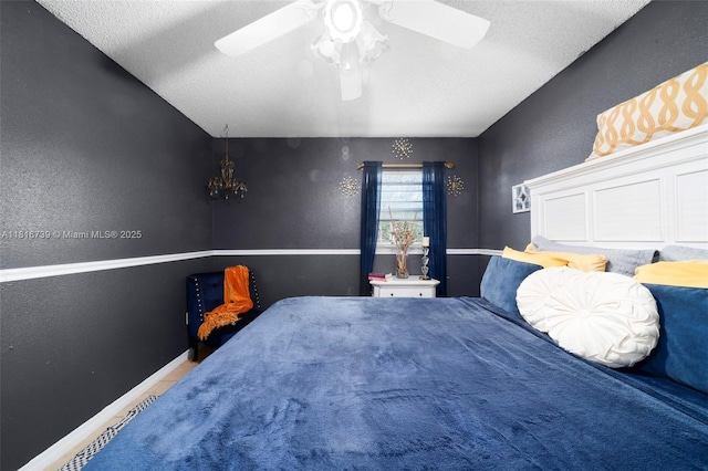 2430 N Dunwoodie Rd, Avon Park, FL 33825 - bedroom featuring a ceiling fan, a textured ceiling, and a textured wall