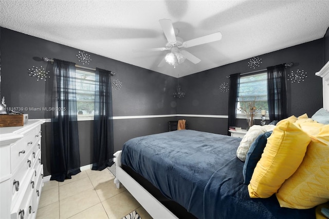 2430 N Dunwoodie Rd, Avon Park, FL 33825 - bedroom with light tile patterned floors, a textured ceiling, and a ceiling fan