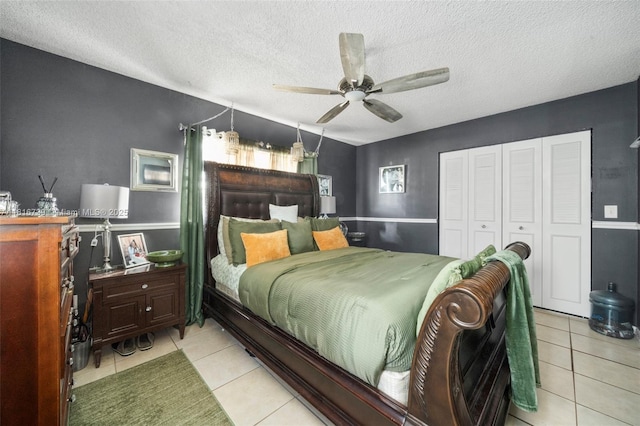 2430 N Dunwoodie Rd, Avon Park, FL 33825 - bedroom featuring light tile patterned floors, a textured ceiling, a closet, and ceiling fan