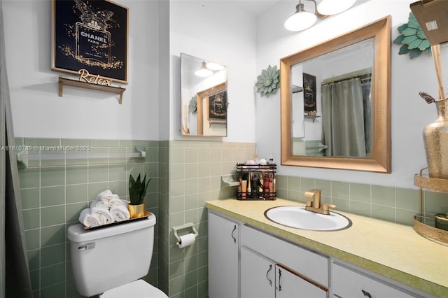 2430 N Dunwoodie Rd, Avon Park, FL 33825 - bathroom with vanity, tile walls, a shower with curtain, and a wainscoted wall