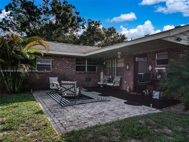 2430 N Dunwoodie Rd, Avon Park, FL 33825 - rear view of property with brick siding and a patio area