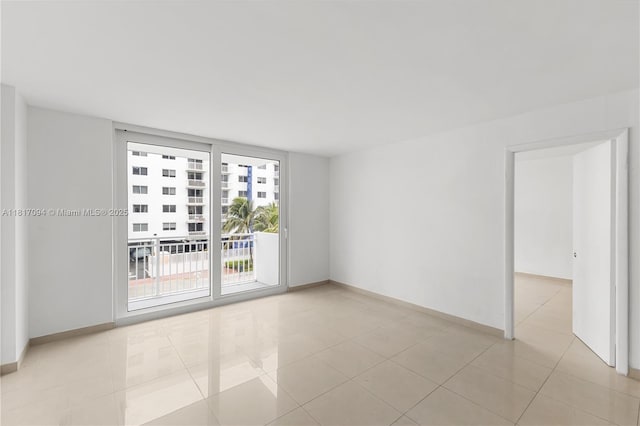 345 Ocean Dr Unit 321, Miami Beach, FL 33139 - empty room featuring light tile patterned floors