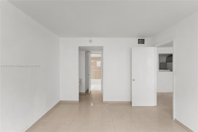 345 Ocean Dr Unit 321, Miami Beach, FL 33139 - empty room featuring baseboards and light tile patterned floors