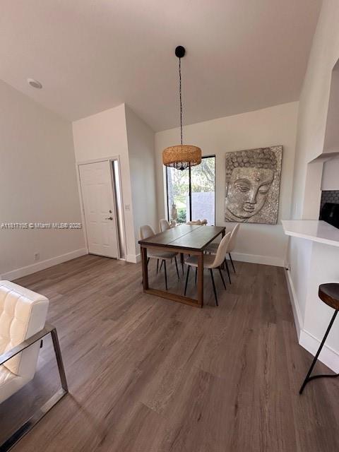 12 Via De Casas Sur Unit 104, Boynton Beach, FL 33426 - dining area featuring wood finished floors and baseboards