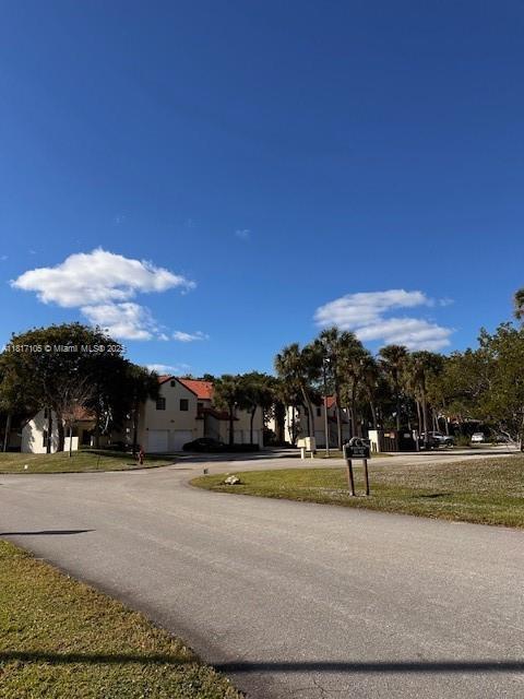12 Via De Casas Sur Unit 104, Boynton Beach, FL 33426 - view of asphalt road