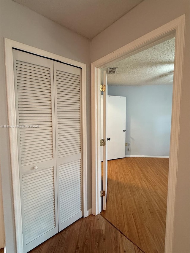 3705SW 27 Th St Unit 416, Gainesville, FL 32608 - corridor featuring wood finished floors and baseboards