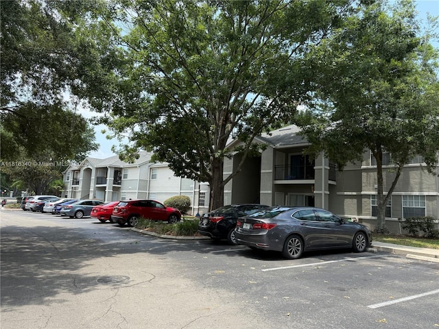 3705SW 27 Th St Unit 416, Gainesville, FL 32608 - view of building exterior with uncovered parking