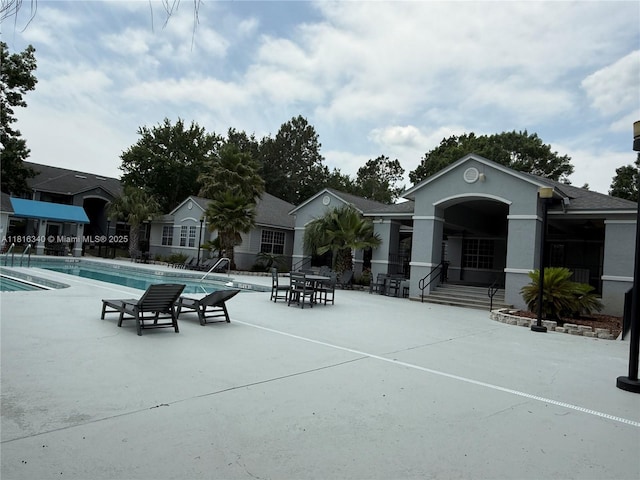 3705SW 27 Th St Unit 416, Gainesville, FL 32608 - view of community featuring a pool and a patio