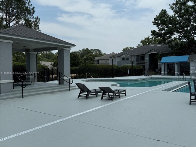 3705SW 27 Th St Unit 416, Gainesville, FL 32608 - community pool featuring a patio