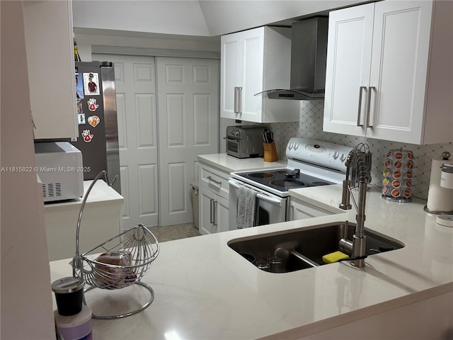 6560 SW 138th Ct Unit 804, Miami, FL 33183 - kitchen with wall chimney range hood, white appliances, light countertops, and white cabinetry