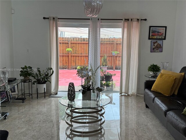 6560 SW 138th Ct Unit 804, Miami, FL 33183 - living room featuring plenty of natural light and marble tiled floors
