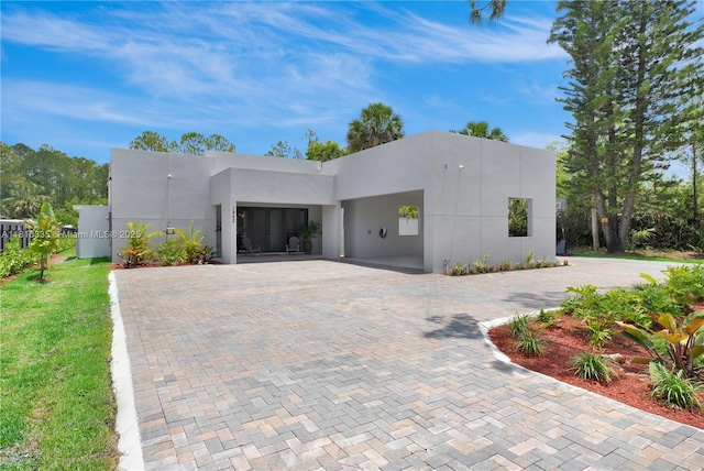 1902 Della Dr, Naples, FL 34117 - contemporary home with stucco siding and decorative driveway