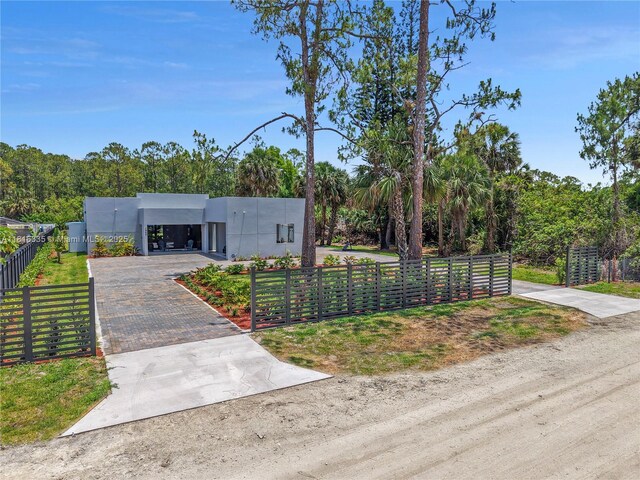1902 Della Dr, Naples, FL 34117 - view of front of property featuring stucco siding and driveway