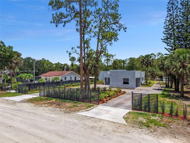 1902 Della Dr, Naples, FL 34117 - view of front of property with a fenced front yard and stucco siding