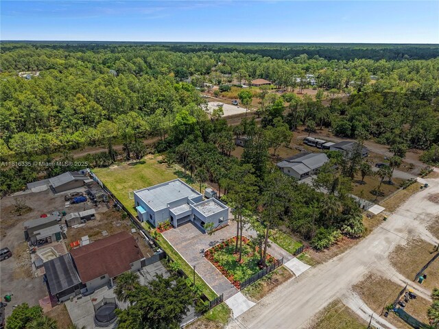 1902 Della Dr, Naples, FL 34117 - aerial view of a heavily wooded area