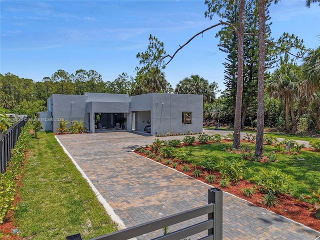 1902 Della Dr, Naples, FL 34117 - view of front of home with stucco siding and decorative driveway