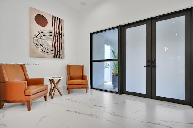 1902 Della Dr, Naples, FL 34117 - sitting room with marble look tile flooring and french doors