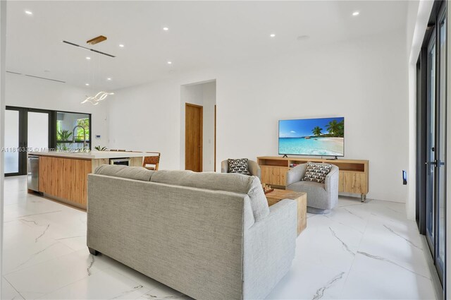 1902 Della Dr, Naples, FL 34117 - living room featuring light marble finish flooring and recessed lighting