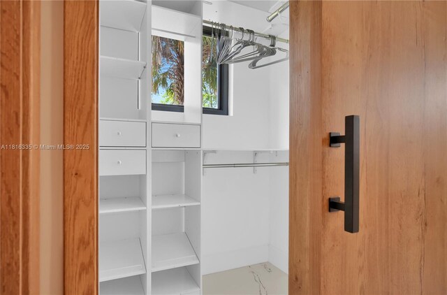 1902 Della Dr, Naples, FL 34117 - spacious closet with marble finish floors