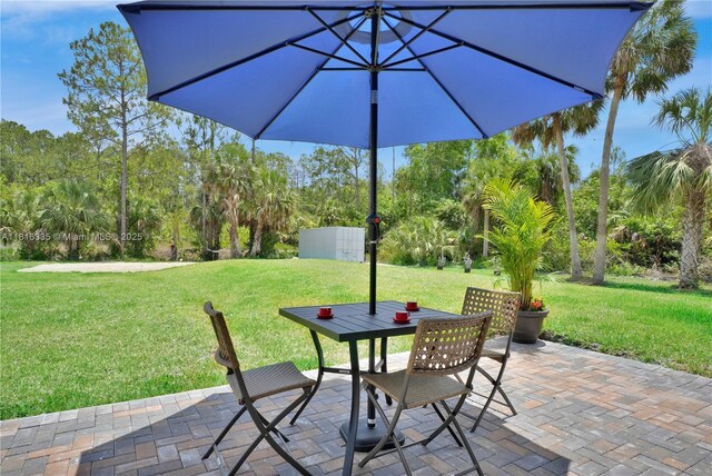 1902 Della Dr, Naples, FL 34117 - view of patio with outdoor dining space