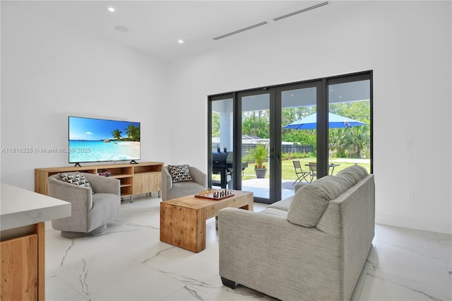 1902 Della Dr, Naples, FL 34117 - living area featuring light marble finish flooring, recessed lighting, and baseboards