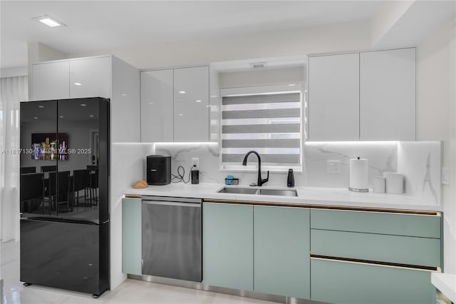 1045 Hollywood Blvd, Hollywood, FL 33019 - kitchen featuring freestanding refrigerator, a sink, modern cabinets, white cabinets, and light countertops