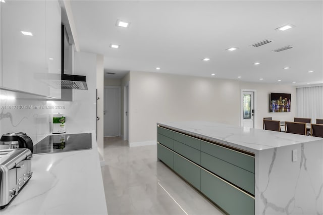 1045 Hollywood Blvd, Hollywood, FL 33019 - kitchen featuring green cabinetry, black electric cooktop, modern cabinets, a kitchen island, and light marble finish floors