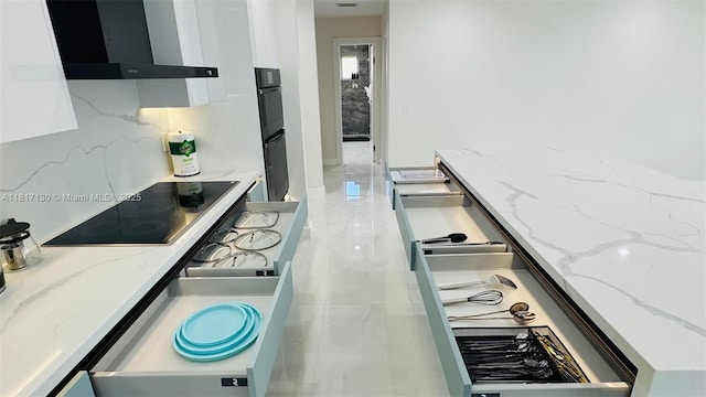 1045 Hollywood Blvd, Hollywood, FL 33019 - kitchen with wall chimney exhaust hood, black appliances, decorative backsplash, white cabinets, and modern cabinets