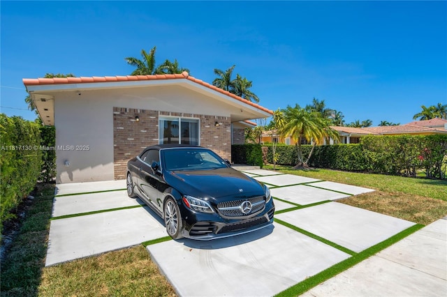 1045 Hollywood Blvd, Hollywood, FL 33019 - view of front of home with a tiled roof and brick siding