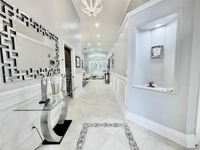 1136 SE Westminster Pl, Stuart, FL 34997 - corridor featuring recessed lighting, vaulted ceiling, crown molding, a wainscoted wall, and a chandelier