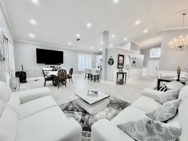 1136 SE Westminster Pl, Stuart, FL 34997 - living area featuring crown molding, a chandelier, a decorative wall, recessed lighting, and a wainscoted wall