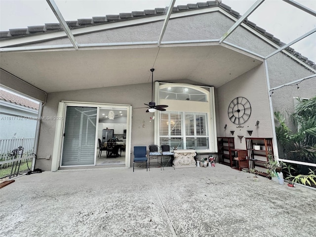1136 SE Westminster Pl, Stuart, FL 34997 - rear view of house with a patio, a ceiling fan, a lanai, and stucco siding