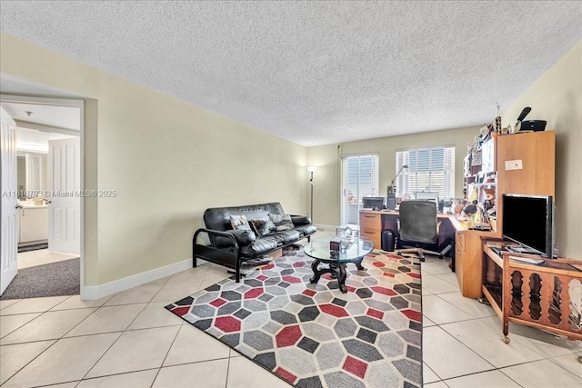 2351 Douglas Rd Unit 1204, Miami, FL 33145 - living area featuring light tile patterned flooring, an office area, a textured ceiling, and baseboards