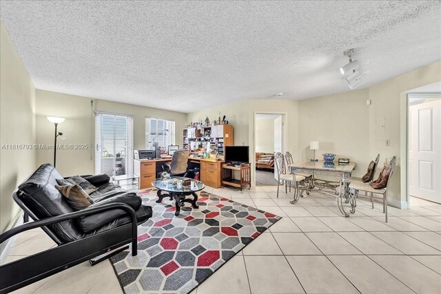 2351 Douglas Rd Unit 1204, Miami, FL 33145 - living room featuring light tile patterned flooring and a textured ceiling