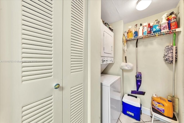 2351 Douglas Rd Unit 1204, Miami, FL 33145 - washroom featuring stacked washer and clothes dryer and light tile patterned floors