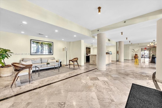 2351 Douglas Rd Unit 1204, Miami, FL 33145 - living area featuring recessed lighting, baseboards, and ornate columns