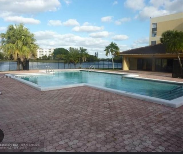 6575 W Oakland Park Blvd Unit 516, Lauderhill, FL 33313 - community pool with a patio area