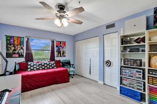 6555 W Broward Blvd Unit 412, Plantation, FL 33317 - bedroom featuring multiple closets, wood finished floors, a ceiling fan, and baseboards