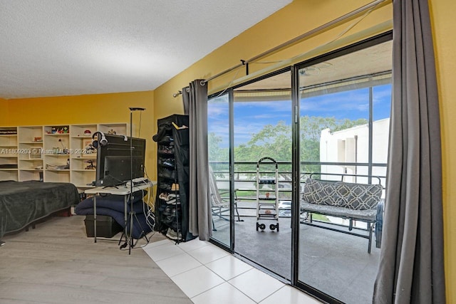 6555 W Broward Blvd Unit 412, Plantation, FL 33317 - doorway to outside with healthy amount of natural light, a textured ceiling, and wood finished floors