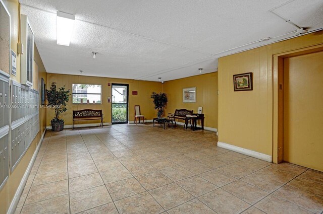 6555 W Broward Blvd Unit 412, Plantation, FL 33317 - lobby featuring a textured ceiling