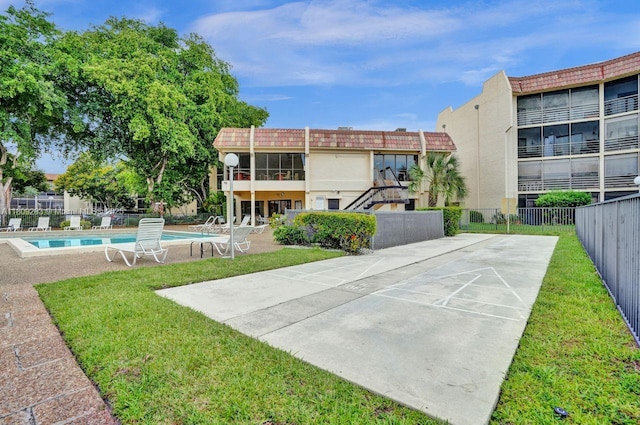 6555 W Broward Blvd Unit 412, Plantation, FL 33317 - surrounding community with shuffleboard and a swimming pool