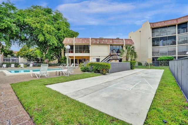 6555 W Broward Blvd Unit 412, Plantation, FL 33317 - view of community with shuffleboard and a swimming pool