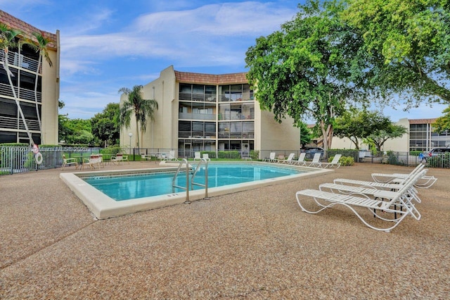 6555 W Broward Blvd Unit 412, Plantation, FL 33317 - community pool featuring a patio area