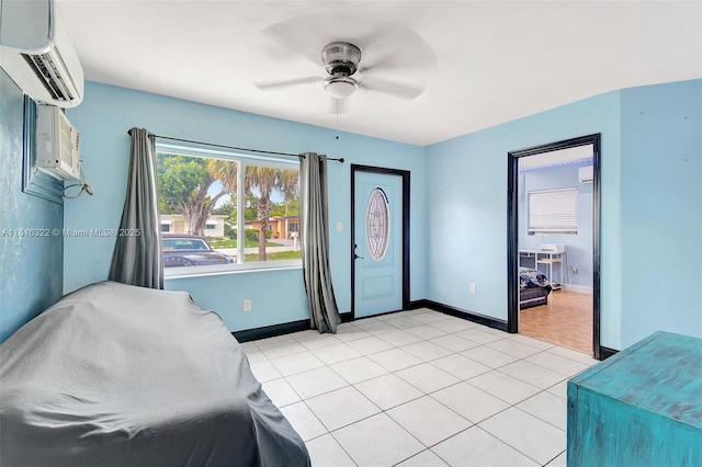 6336 SW 22nd St, Miramar, FL 33023 - bedroom featuring a wall mounted air conditioner, light tile patterned floors, baseboards, and a ceiling fan