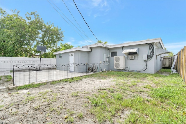 6336 SW 22nd St, Miramar, FL 33023 - rear view of property with a cooling unit, stucco siding, and a fenced backyard