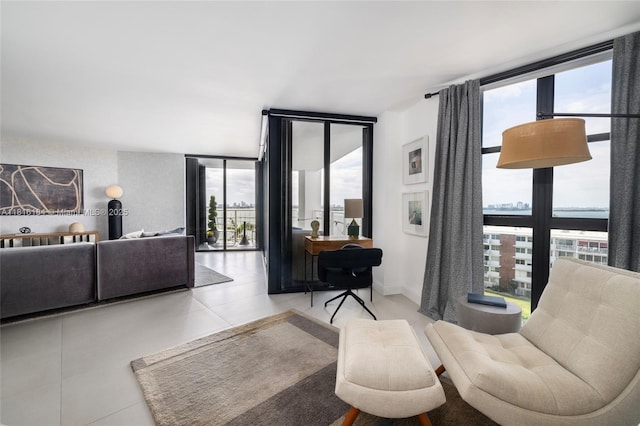 4000 Towerside Ter Unit 804, Miami, FL 33138 - living room featuring a wall of windows and light tile patterned floors