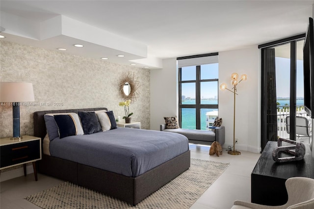 4000 Towerside Ter Unit 804, Miami, FL 33138 - bedroom featuring a wall of windows, a water view, and recessed lighting